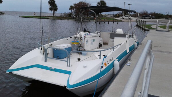 Comfortable 26 foot deck boat for a smooth ride and roomy fishing platform.
