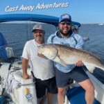 Big redfish caught on a fishing trip with Cast Away Adventures in Florida, showcasing thrilling inshore fishing and outdoor water experiences.