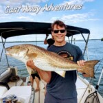 Big redfish caught during Cast Away Adventures fishing trip on a boat in Florida waters.