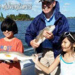 Saltwater fishing adventure with kids and guide on a boat at Castaway Adventures in Florida.